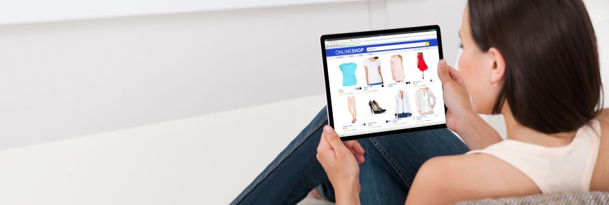 a woman shops online Textiles for clothes