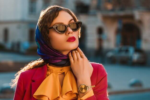 elegant lady wearing trendy colorful head scarf