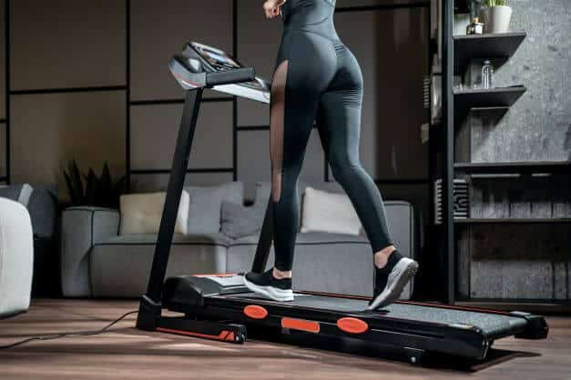 women in trainers on treadmill