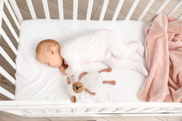 new born baby in crib
