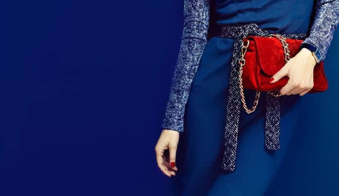 red handbag on blue dress