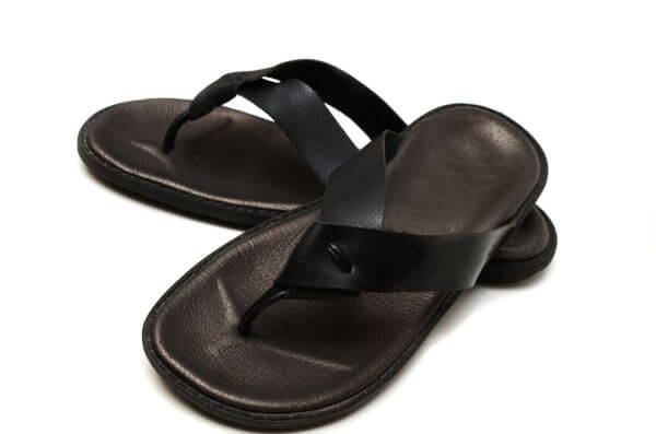 Black leather flip flops