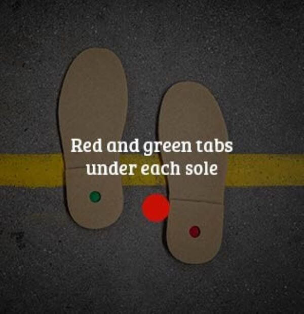 Soles of Kickers with green and red spots determining which is left and right