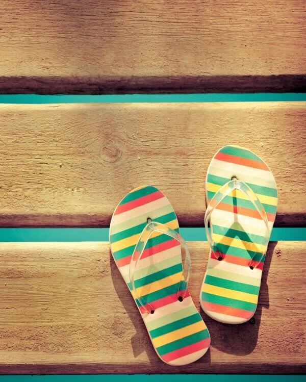A pair of rainbow coloured flip flops