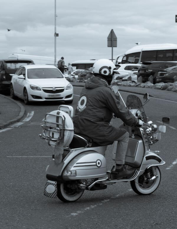 A Mod driving a scooter