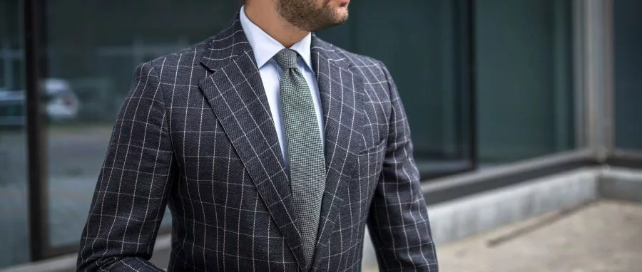 business in chekced charcoal tailored suit jpg