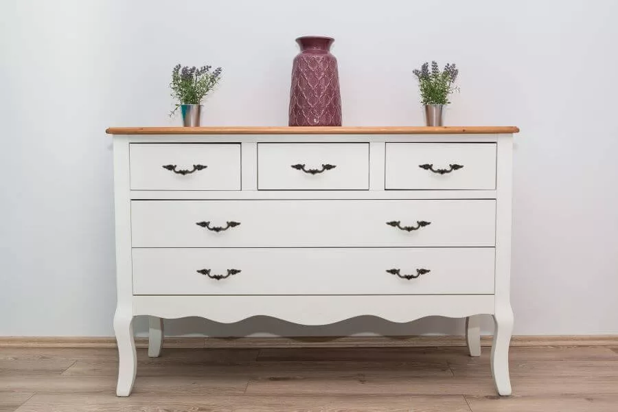 a chest of drawers in a bedroom